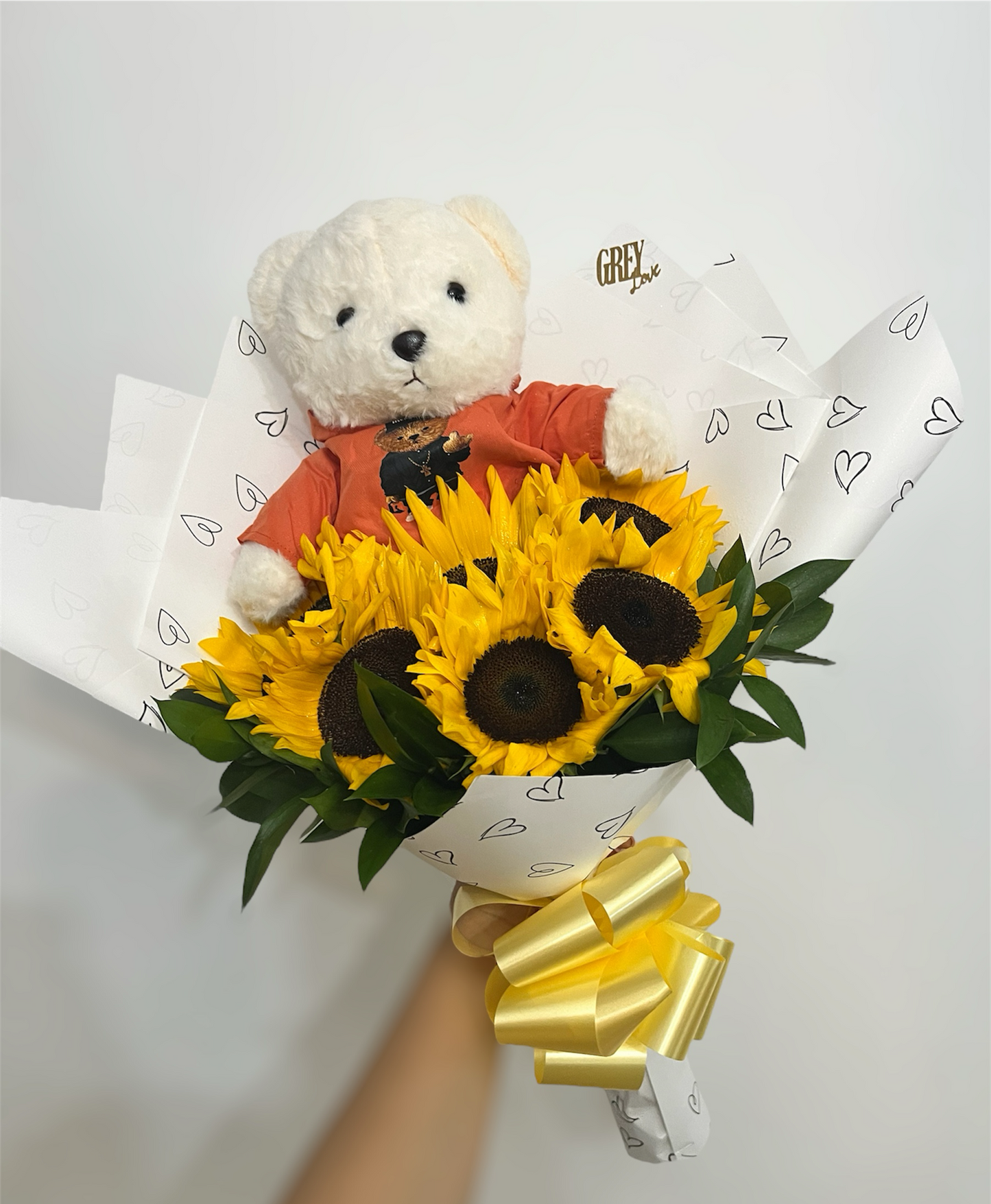 Girasoles con peluche